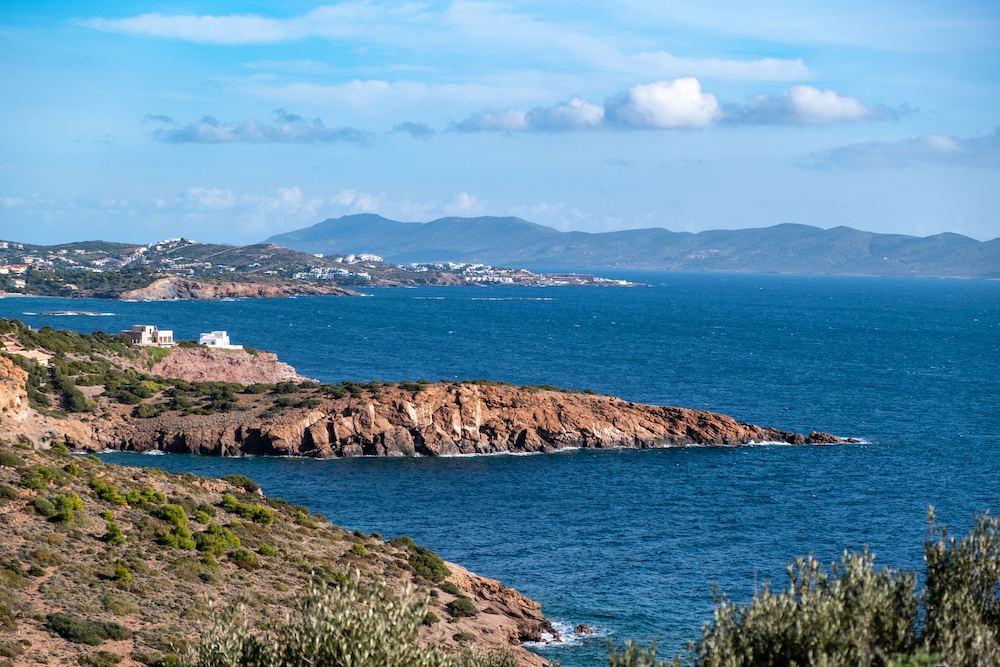 Greece Cape Sounio landscape, Athens Attica. Coastline, rippled sea, cloudy blue sky backgrpund, sunny day